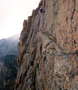 Joe sitting on the far end of Table Ledge, preparing to belay Brian to complete our escape from the East Face of Longs Peak